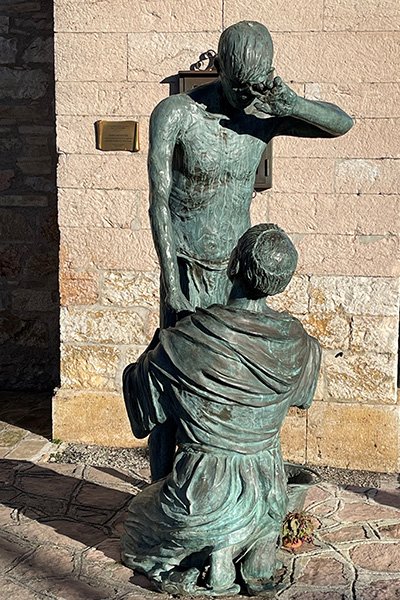 St Francis washing the feet of a leper